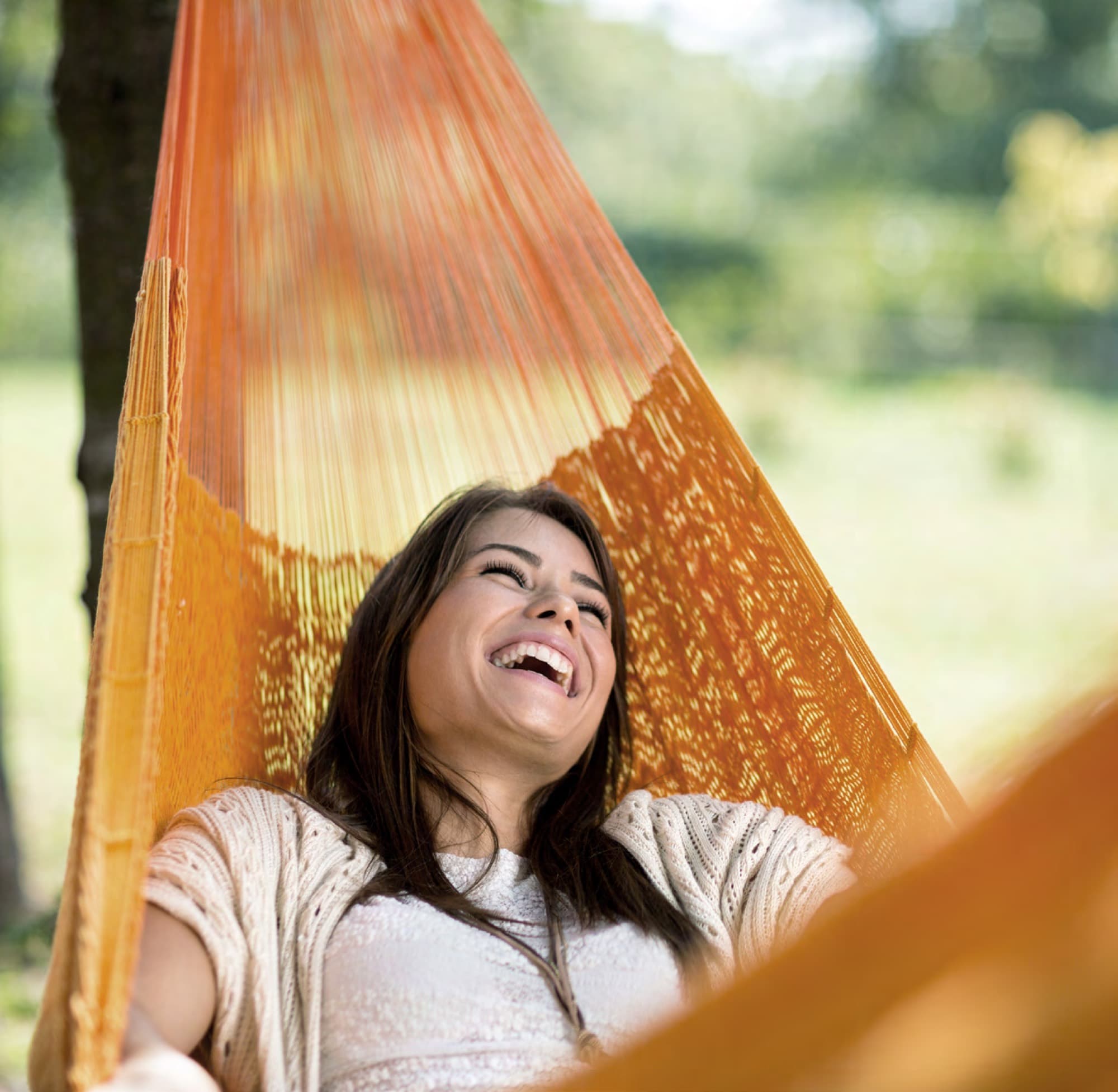 Woman relaxing in a garden hammock, enjoying the settled lifestyle in Arabian Ranches 3. AR3 Living is your go-to expert guide to securing a UAE Golden Visa through property.