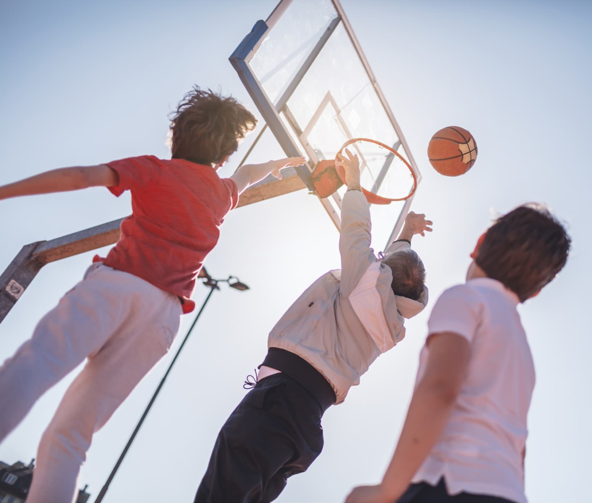 Boys playing basketball in Arabian Ranches 3. AR3 Living is your go-to expert guide to every amenity in the community.