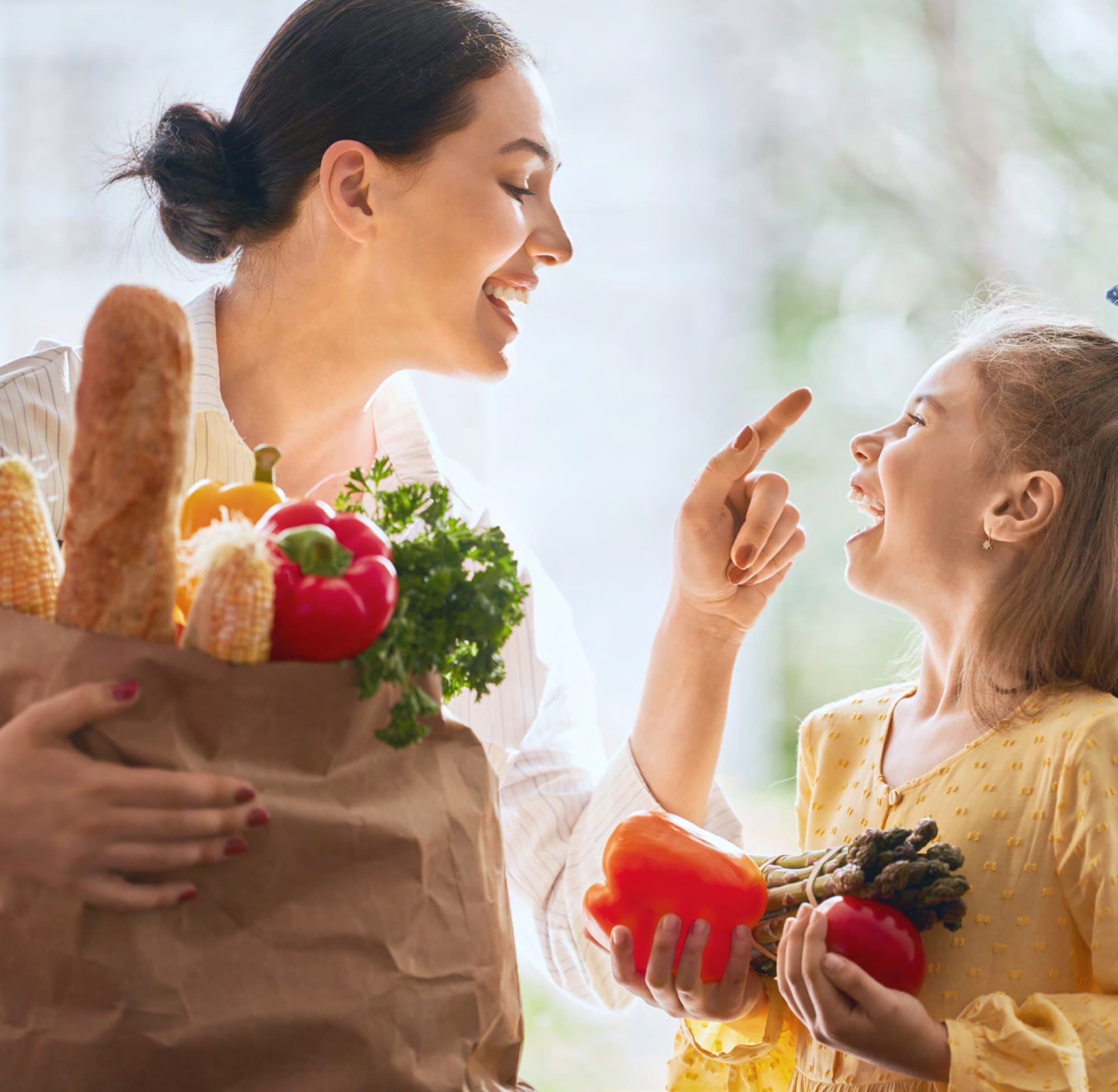 Mother and daughter picking fresh produce, enjoying family life near Arabian Ranches 3. AR3 Living is your go-to local expert on restaurants and cafés near the community.