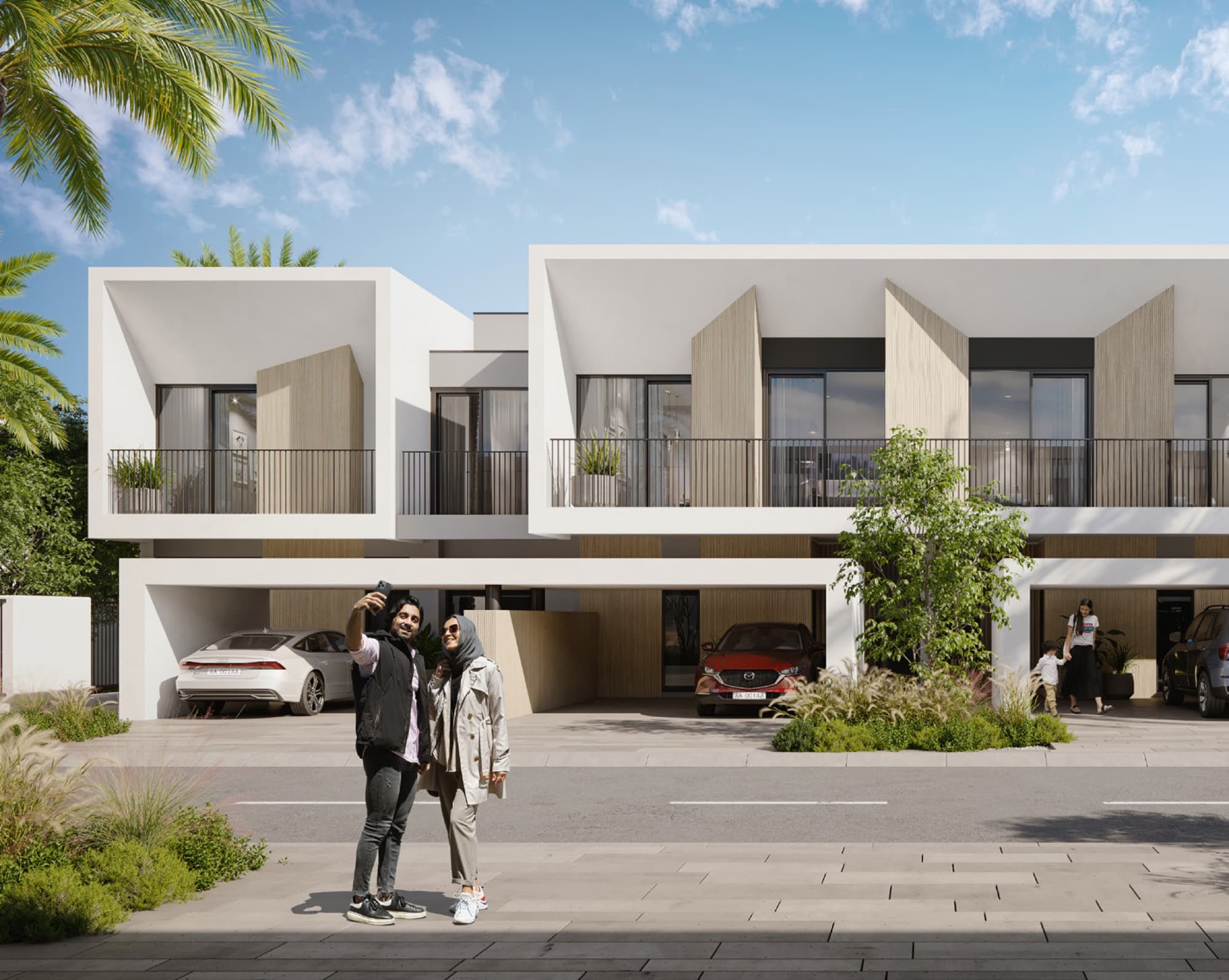 Anya townhouses in Arabian Ranches 3, Dubai: contemporary white and timber-accented façade with couple photographing the entrance.