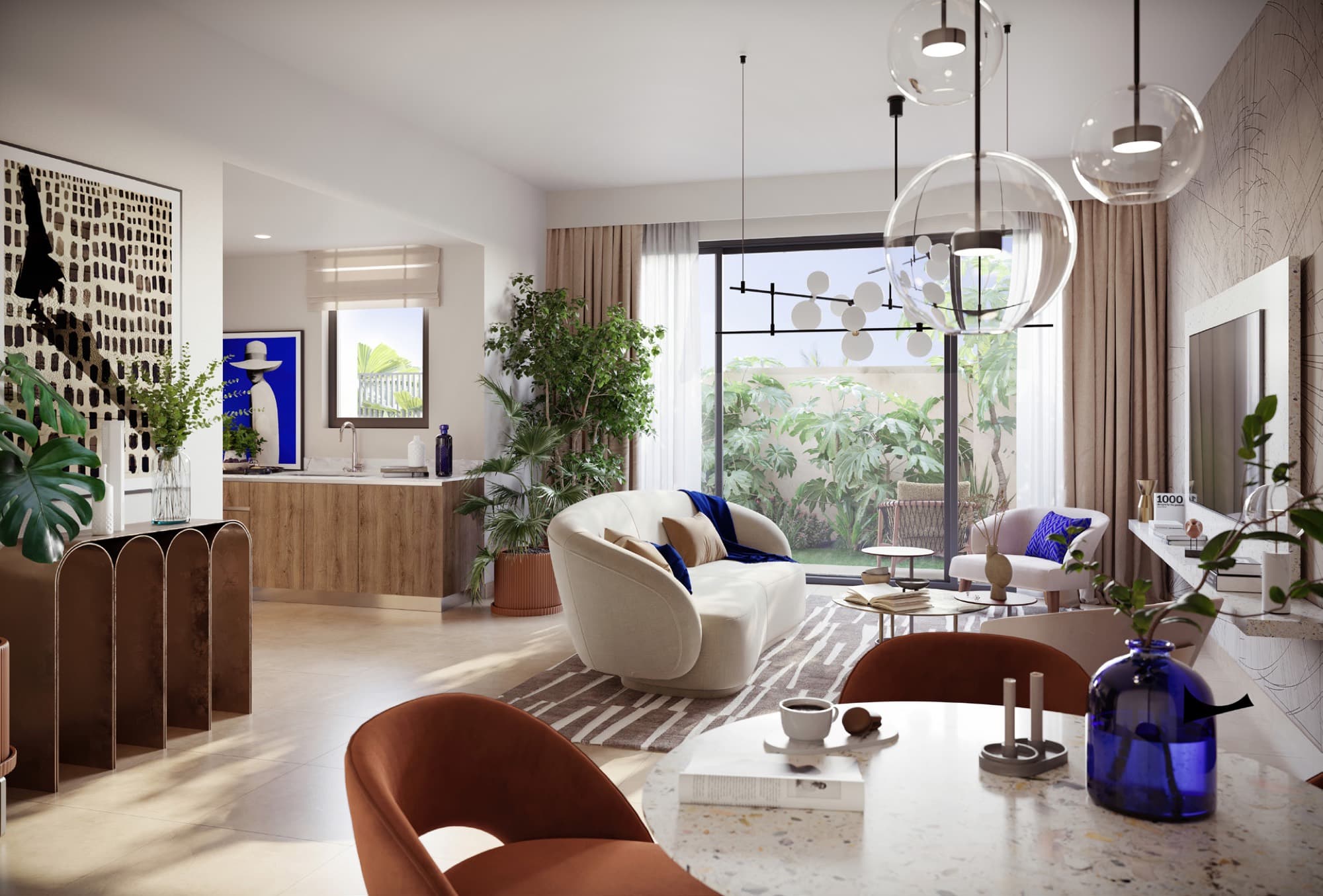 Open-plan living and dining area inside an Anya townhouse, Arabian Ranches 3, with terracotta chairs and garden doors.