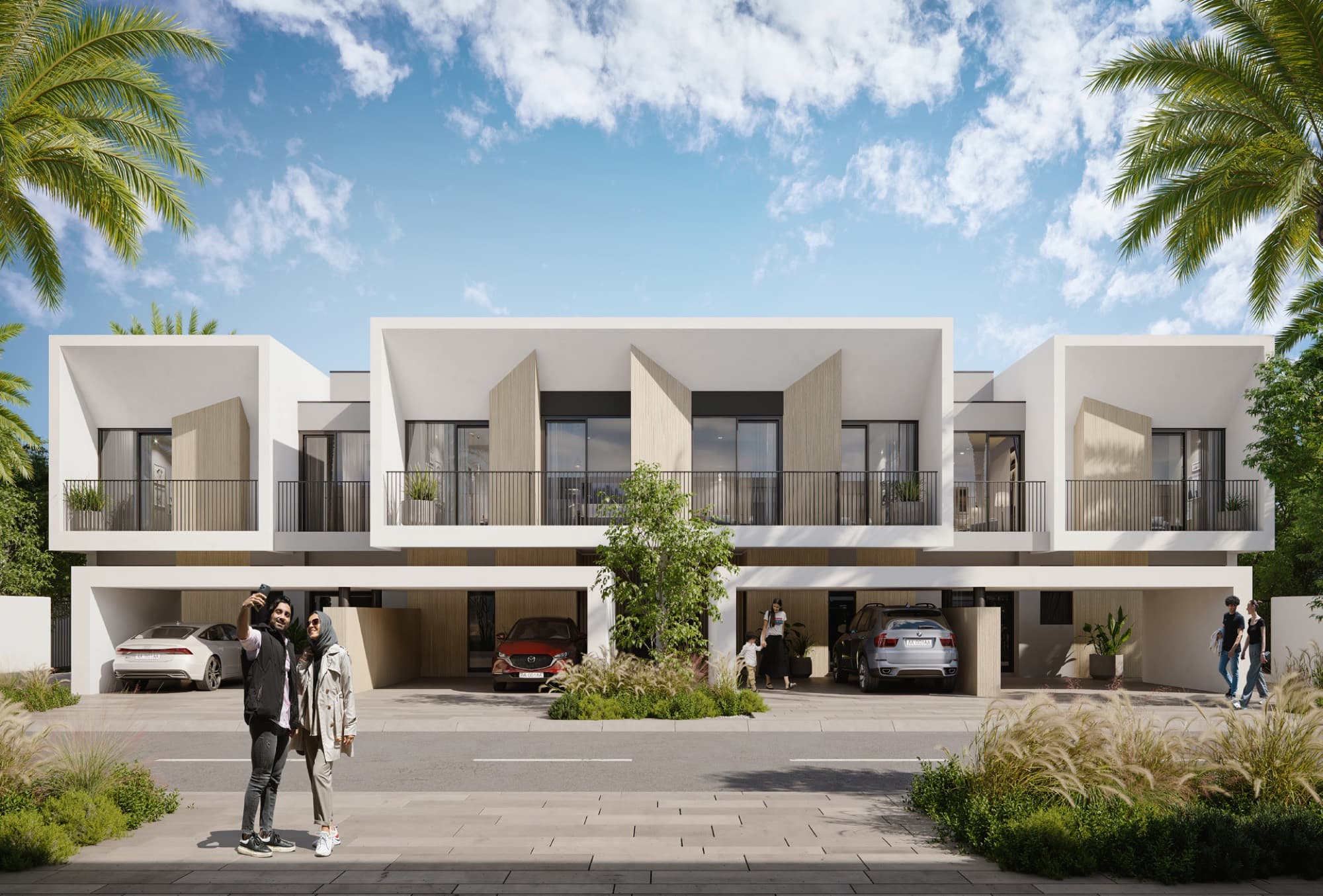 Anya townhouse row in Arabian Ranches 3, Dubai, with covered driveways, parked cars and a family with a pram.
