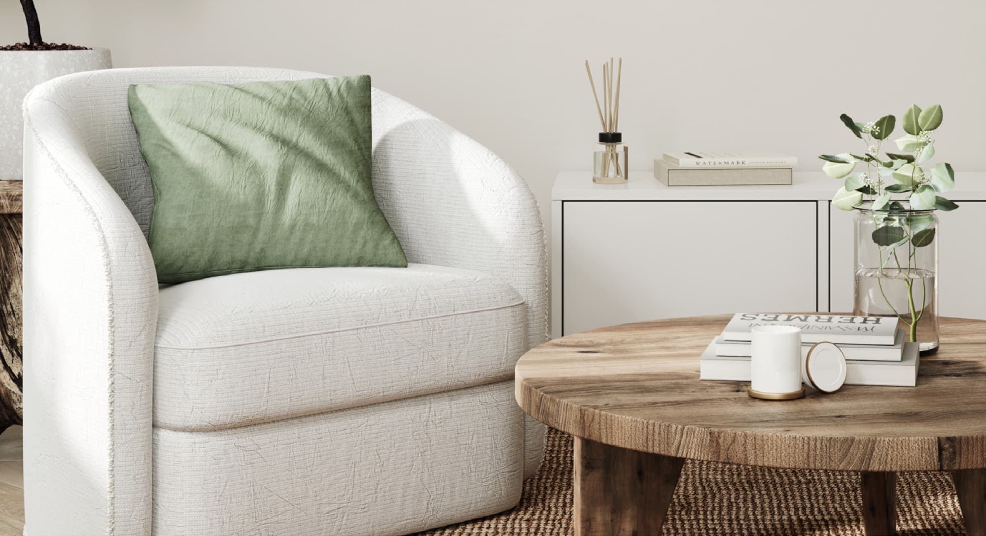 Living room corner in an Anya 2 townhouse, Arabian Ranches 3, with a bouclé armchair, green cushion and console table.
