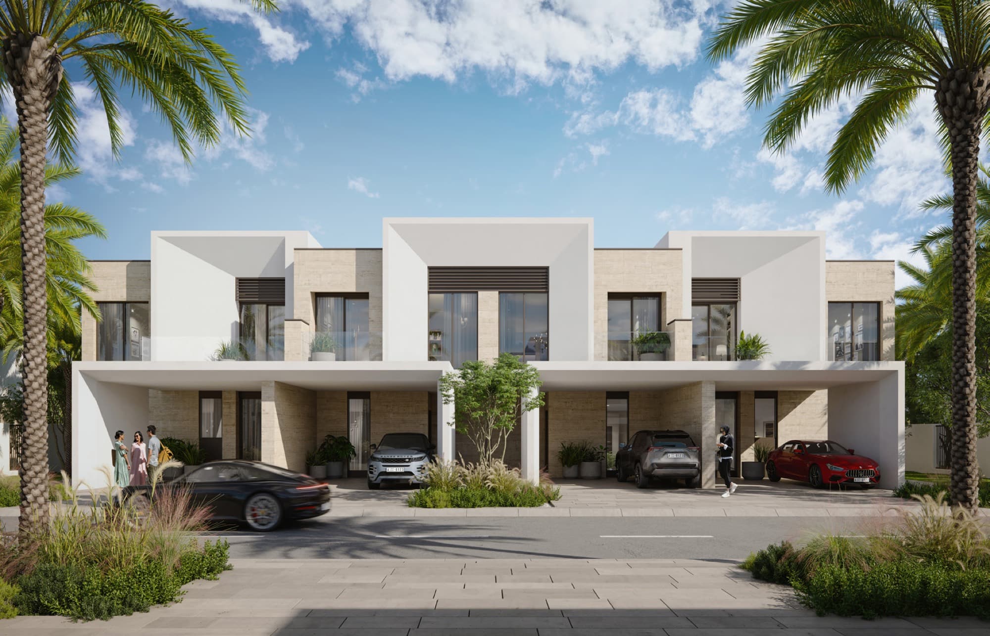 Anya 2 townhouse façade in Arabian Ranches 3, Dubai, with covered parking bays, parked cars and a family group outside.