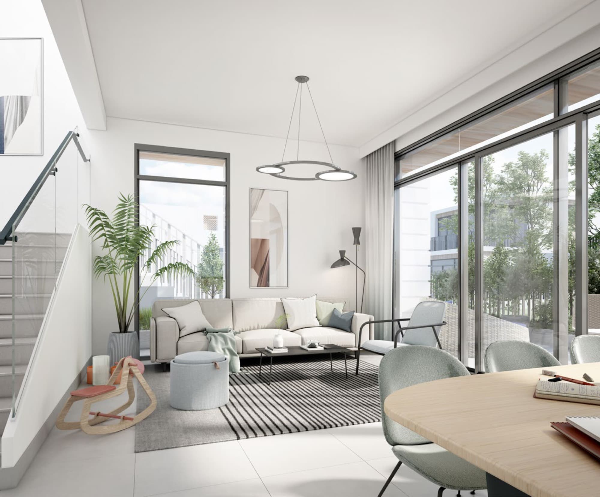 Fitted kitchen with island seating in a Bliss townhouse, Arabian Ranches 3, Dubai, opening onto a private terrace.