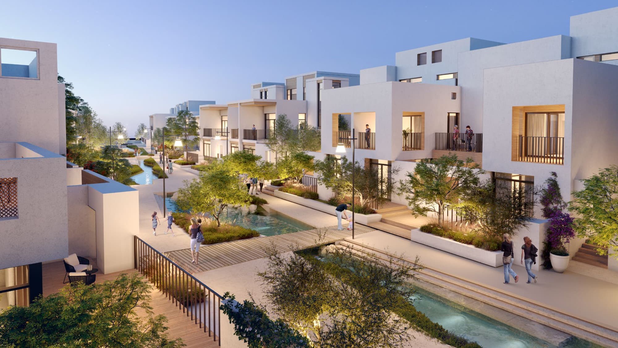 Open-plan living and dining area in a Bliss townhouse, Arabian Ranches 3, Dubai, with a corner sofa and full-height garden windows.