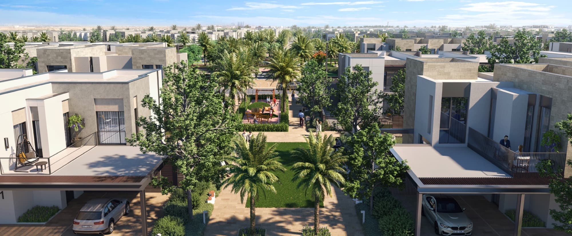 Children’s play area shaded by mature palm trees within the Bliss 2 cluster, Arabian Ranches 3, Dubai.