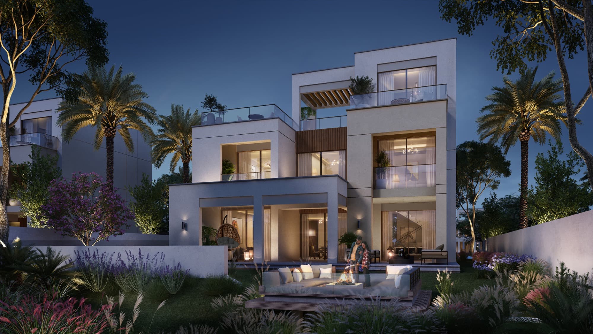Detached Caya 2 villa in Arabian Ranches 3, Dubai, lit at dusk with a rooftop terrace and layered balconies.