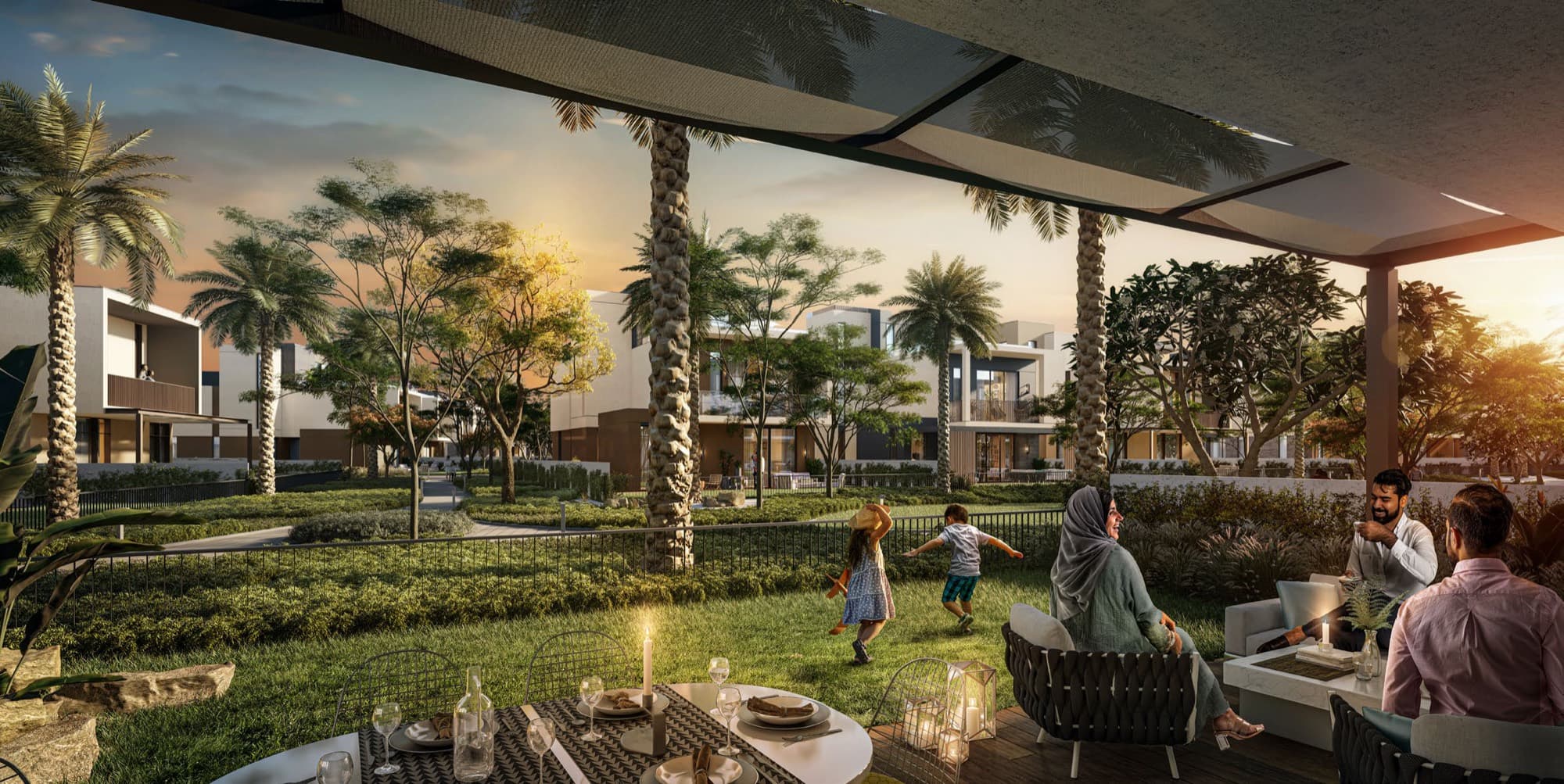 Evening terrace dining at an Elie Saab villa, Arabian Ranches 3, family gathered under string lighting beside the garden.