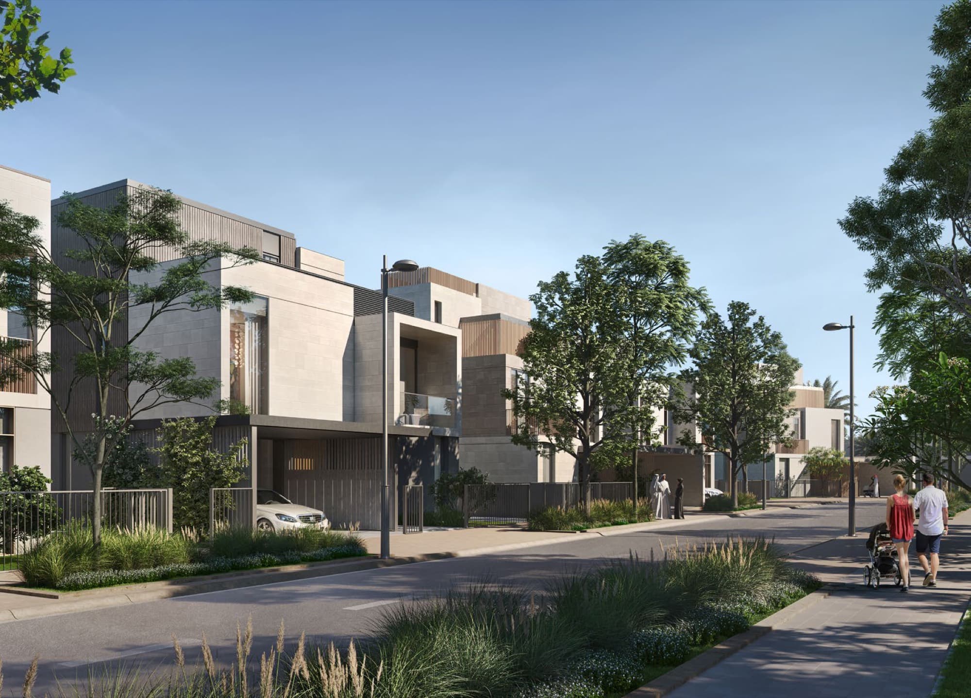 Daytime street view of Elie Saab Villas in Arabian Ranches 3, Dubai, showing the stone-clad façades of the designer-branded villas.