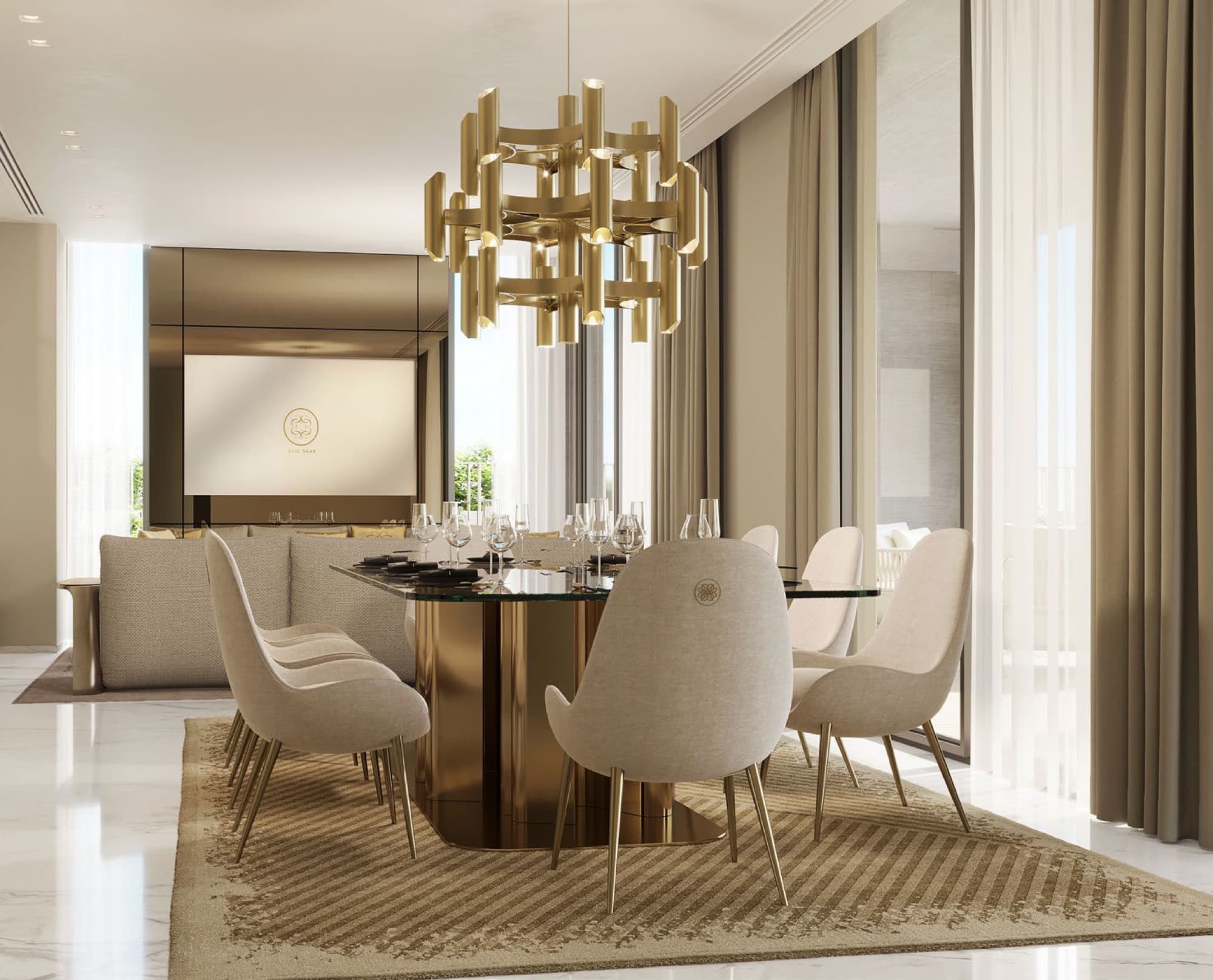 Dining room in an Elie Saab villa, Arabian Ranches 3, with a gold chandelier, glass-top table and Elie Saab branded screen.