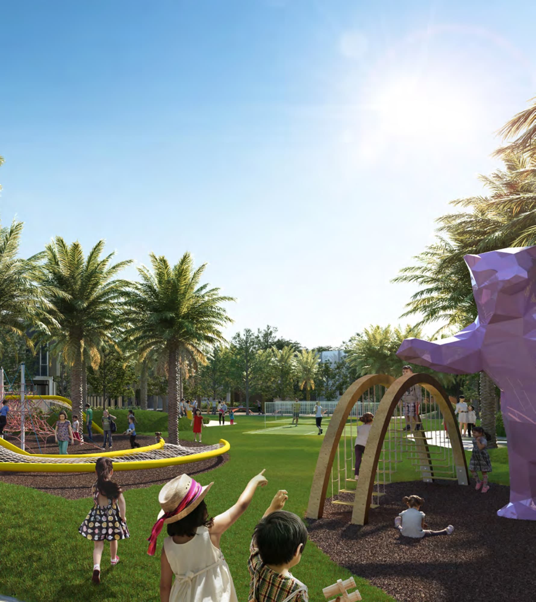 Children playing on a rope-net climbing frame in a landscaped park at Joy, Arabian Ranches 3, Dubai.
