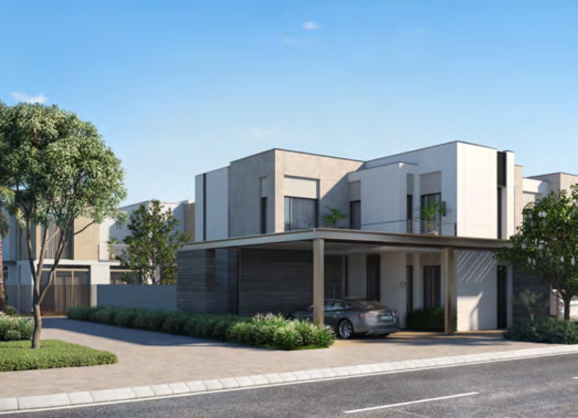 Joy townhouse exterior with driveway, parked car and shaded carport, Arabian Ranches 3, Dubai.