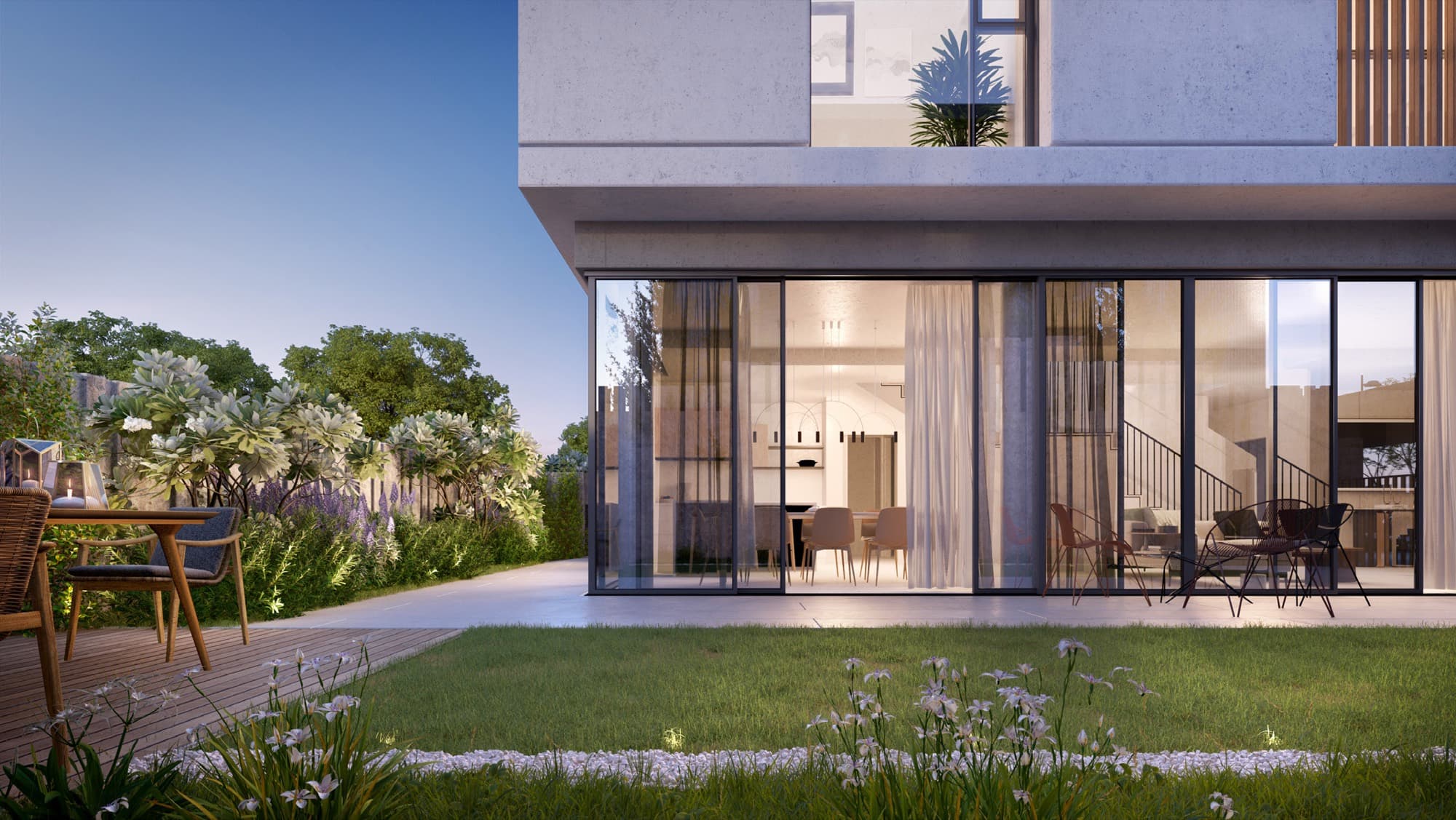 Twilight exterior of a June villa in Arabian Ranches 3, Dubai, showing the glazed rear living area opening onto a private garden.