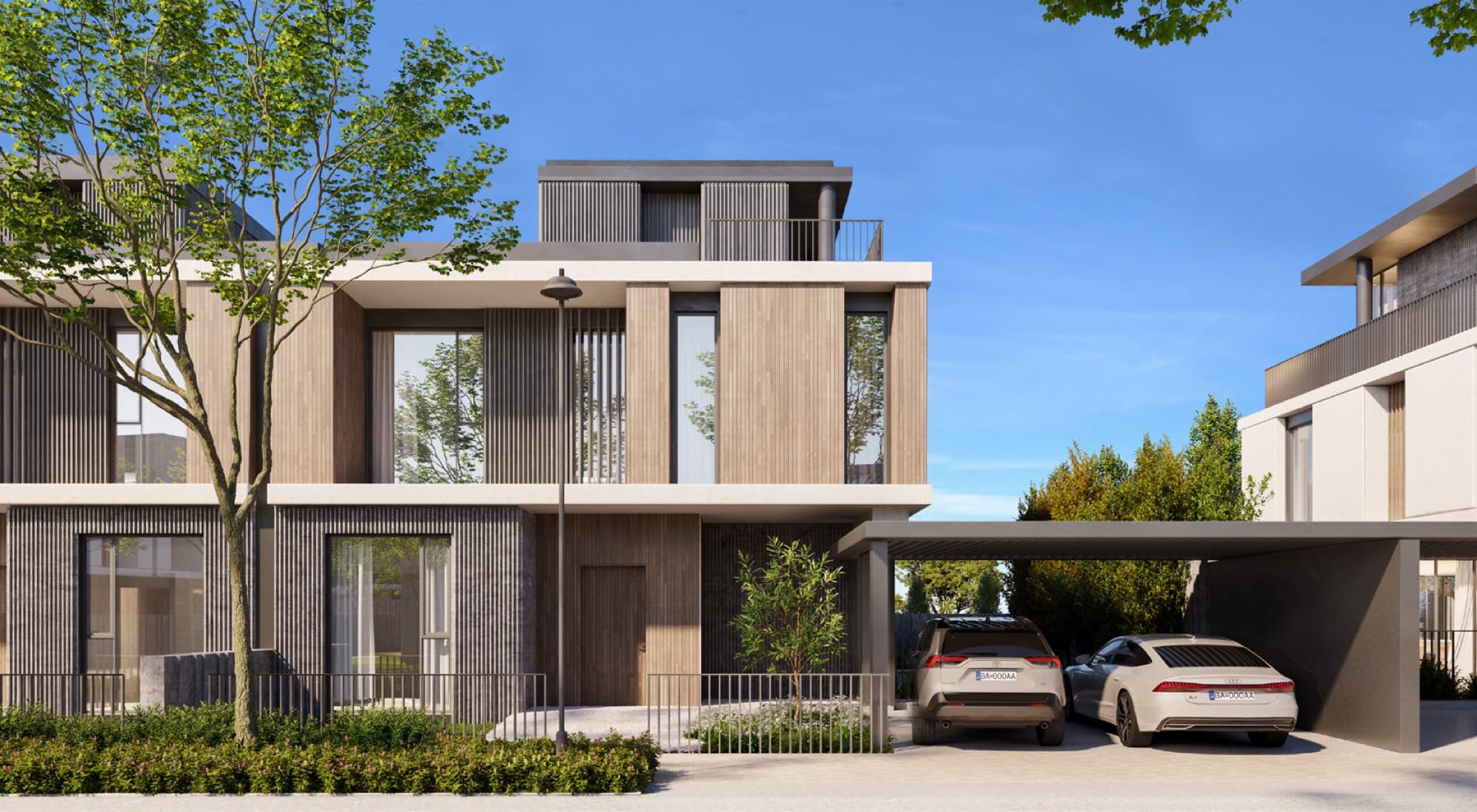 Corner elevation of a June villa in Arabian Ranches 3, Dubai, showing the light stone façade, upper balcony and covered carport.