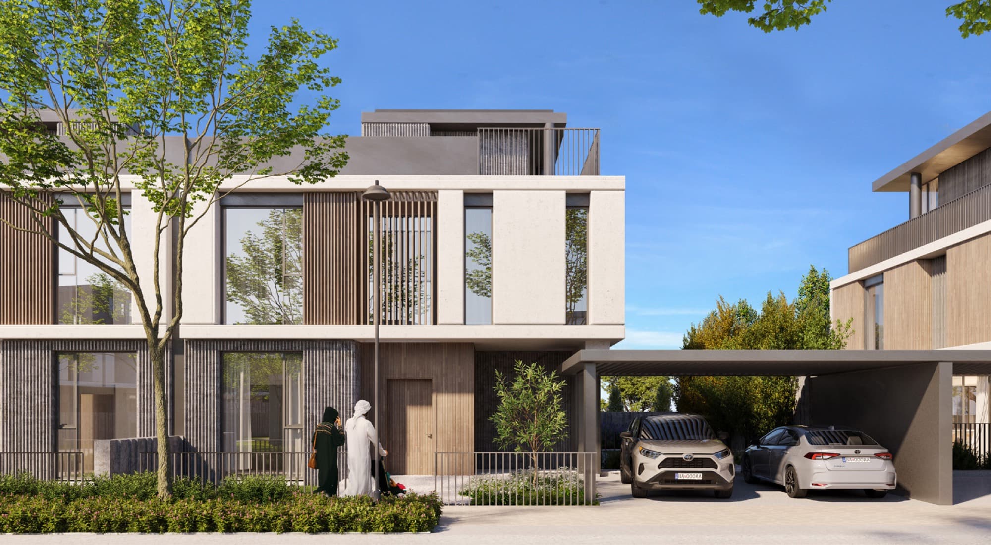 Front façade of a June 2 villa in Arabian Ranches 3, Dubai, framed by mature trees with two cars parked under the carport.