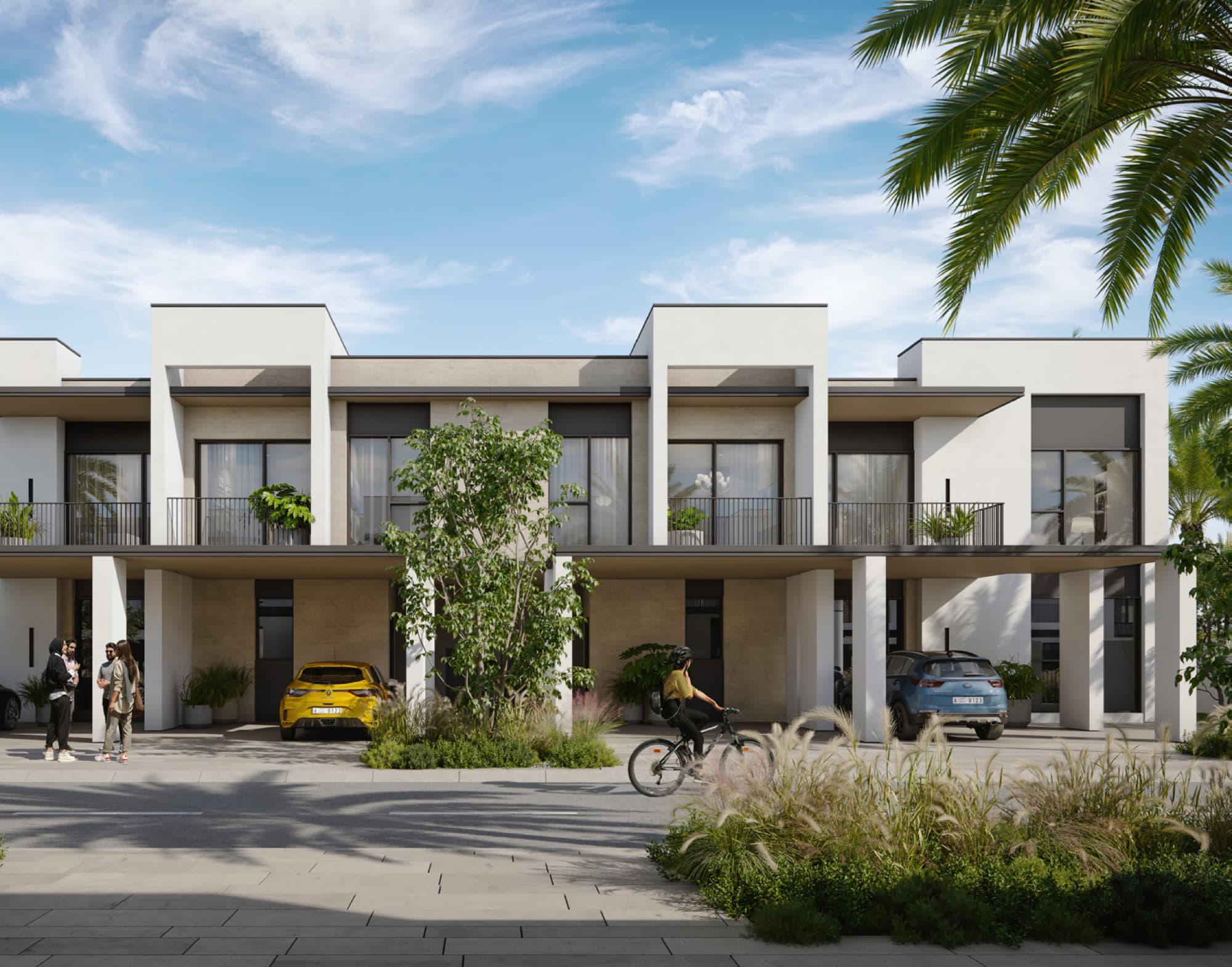 Row of white-render townhouses in May, Arabian Ranches 3, Dubai, with residents and a cyclist on the tree-lined street.