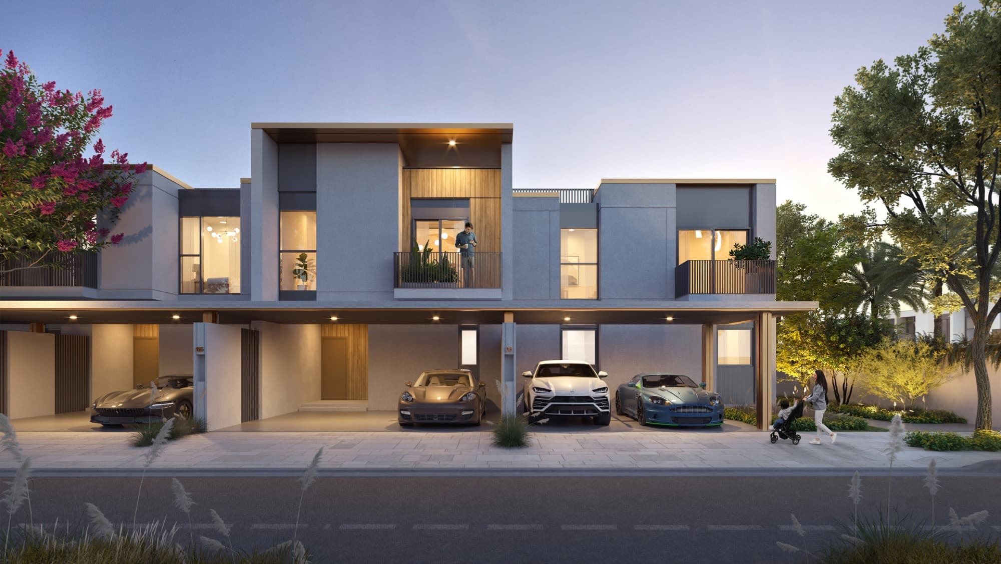 Twilight view of a Raya townhouse in Arabian Ranches 3, Dubai, with sports cars parked beneath the covered carport.