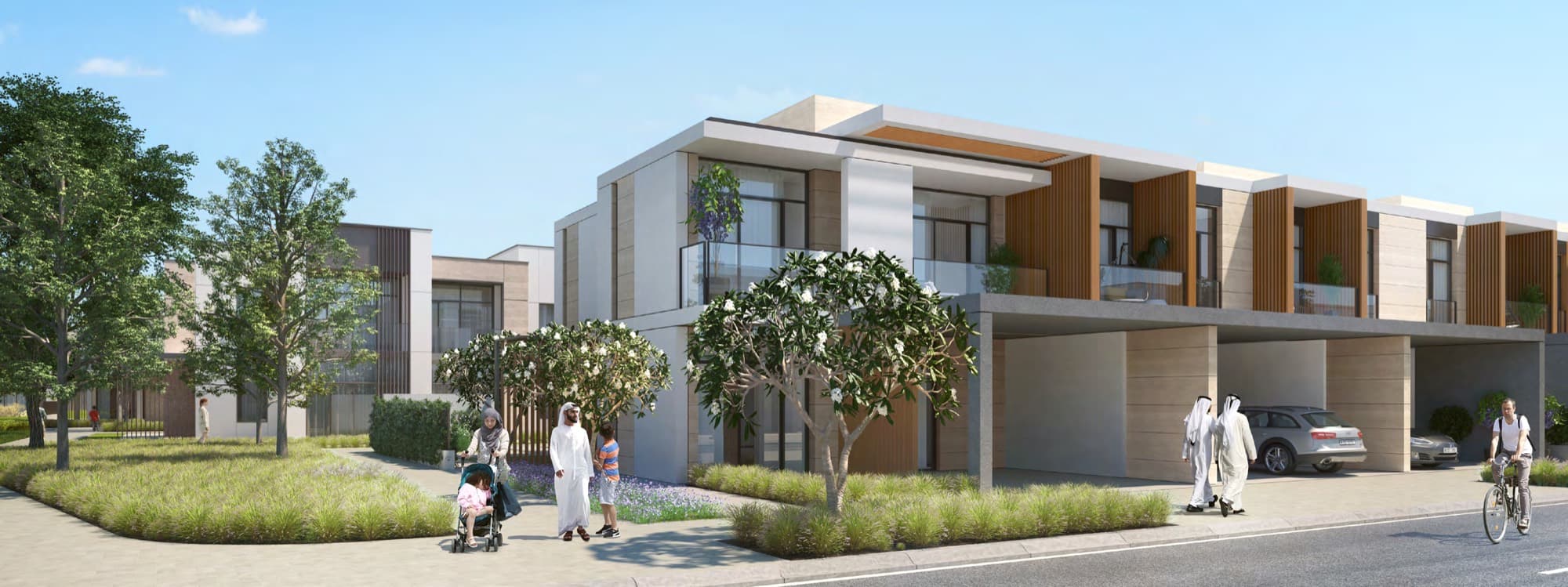 Ruba townhouse exterior with family and cyclist on the street, timber balcony detailing, Arabian Ranches 3, Dubai.