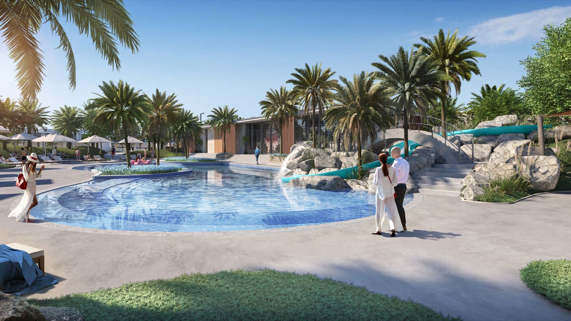 Community pool with rock-feature waterslide and loungers at Ruba, Arabian Ranches 3, Dubai.