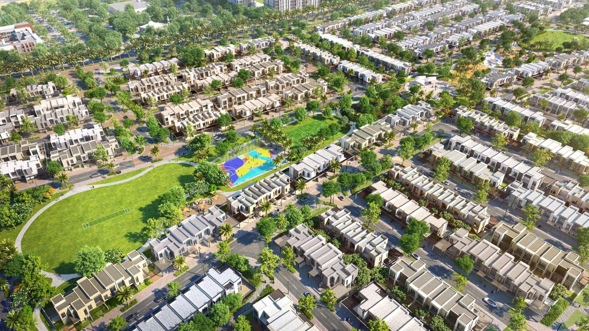 Aerial view of Sun's townhouse rows, central park, sports court and playground, Arabian Ranches 3, Dubai.