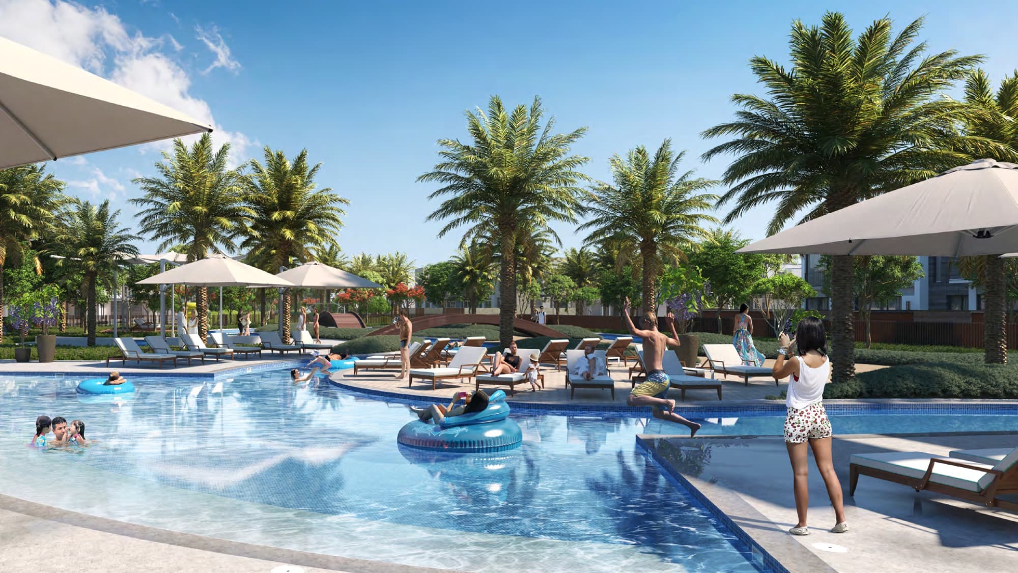 Families and children playing at the community pool with sun loungers and palm trees at Sun, Arabian Ranches 3, Dubai.