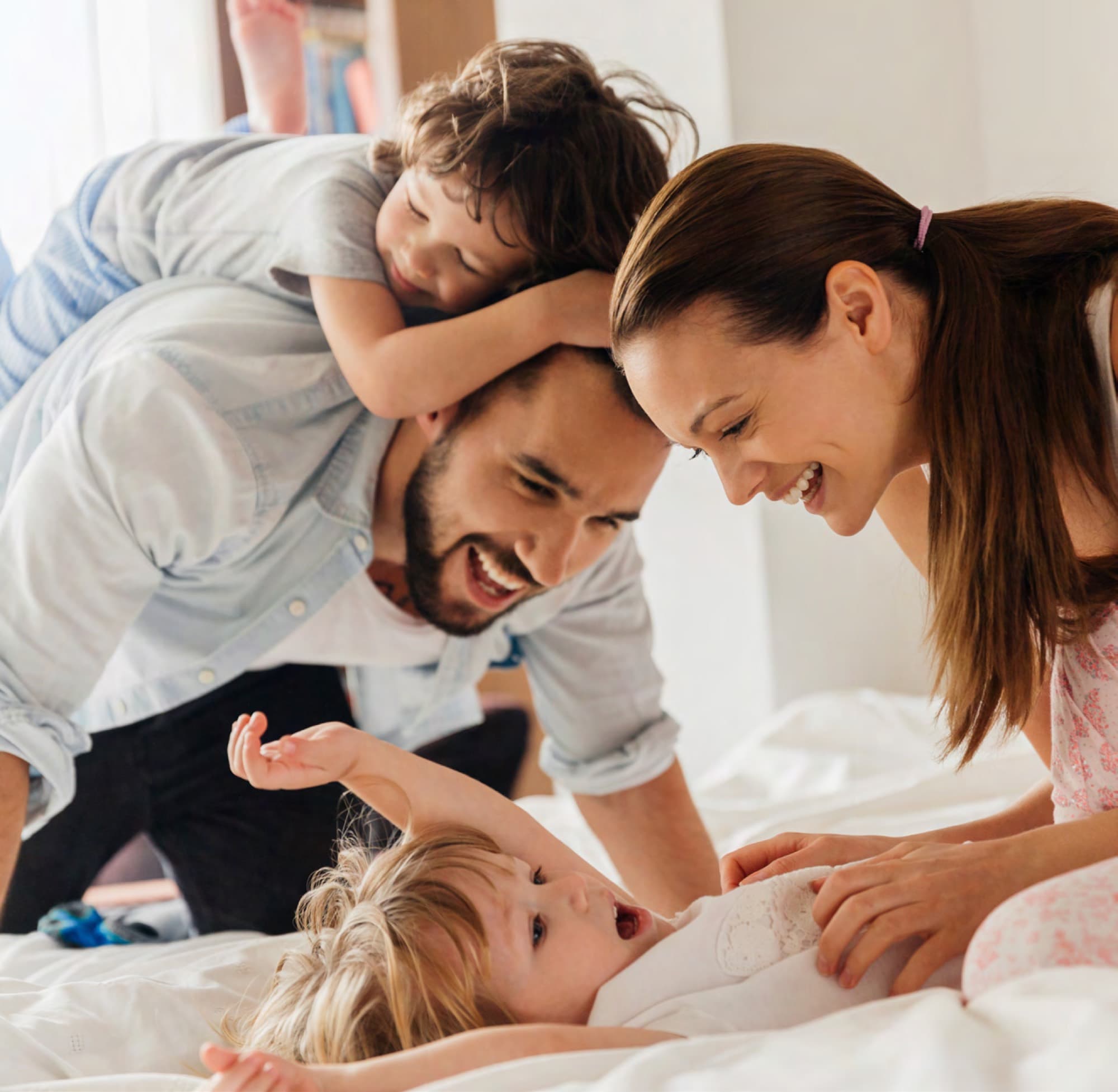 Family playing together at home in Arabian Ranches 3. AR3 Living is your go-to expert guide to buying off-plan property in the community.